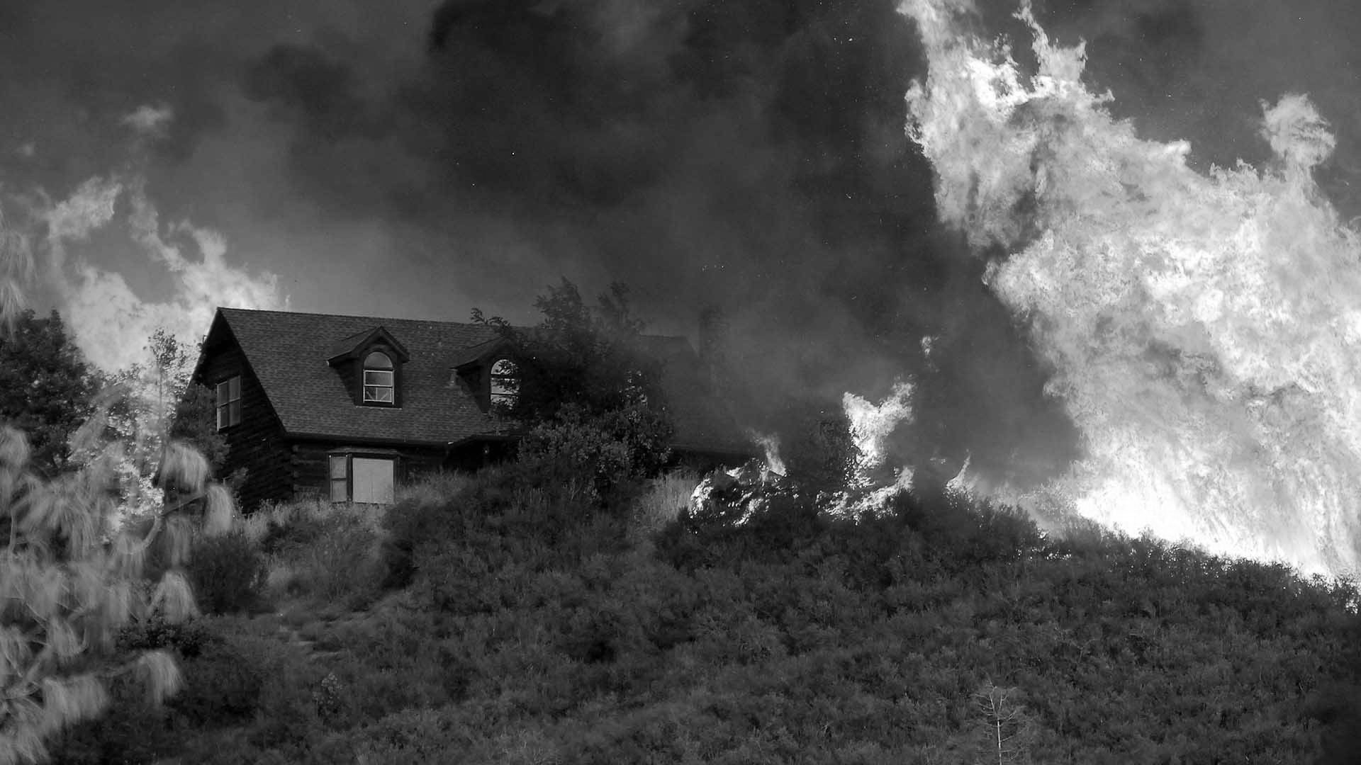 wildfire approaching suburban homes